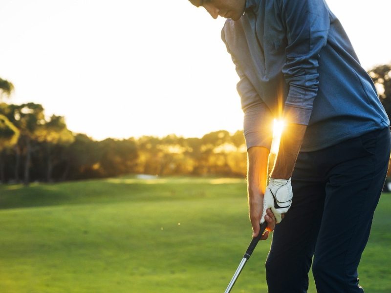 Golfer Holding Club